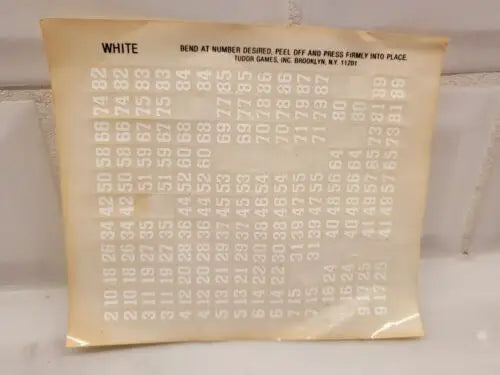 Vintage sheet of white number stickers for Buccaneers electronic football players
