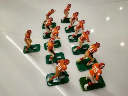 Vintage electric football figures representing Buccaneers electronic football players from NFL Tudor 11 series