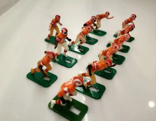 Vintage electric football figures representing NFL Tampa Bay Buccaneers electronic football players