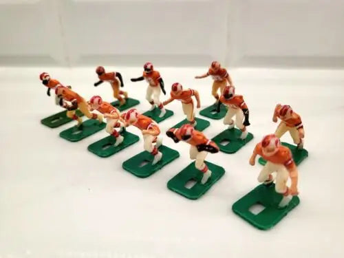 Vintage electric football figures featuring NFL Tampa Bay Buccaneers electronic football players