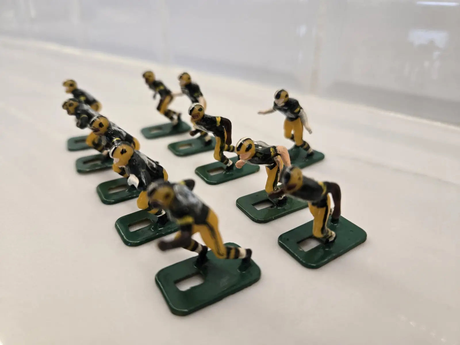 Miniature football player figurines of Green Bay Packers for NFL Vintage Tudor game
