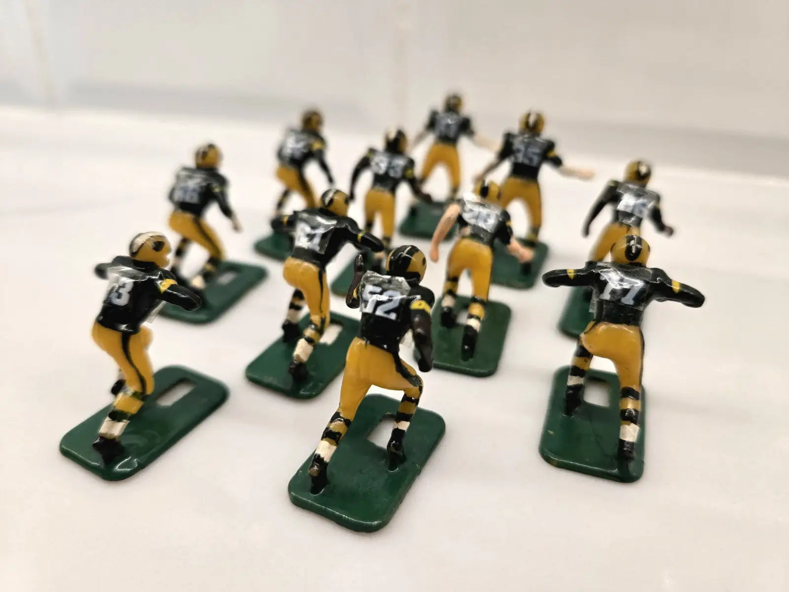 Miniature football player figurines of Green Bay Packers for NFL Vintage Tudor Black Shoe