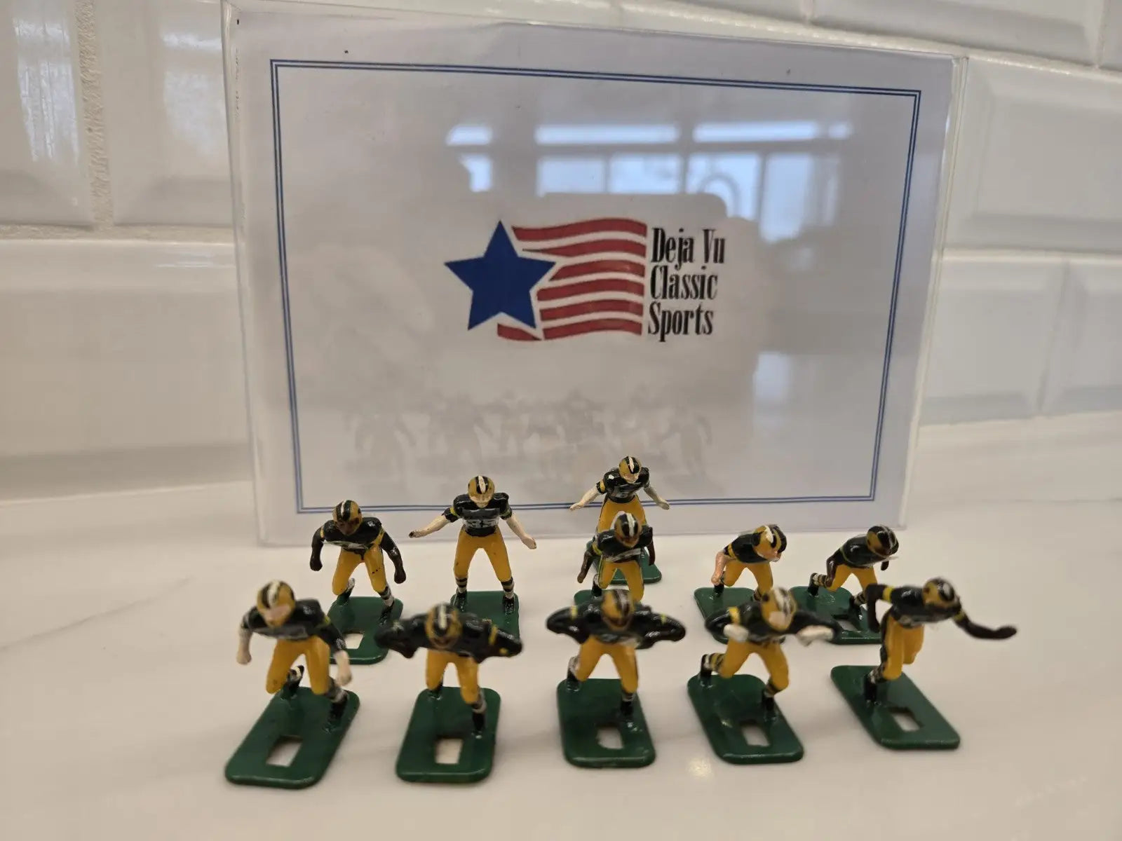 Toy football players from NFL Vintage Tudor Black Shoe featuring Green Bay Packers theme