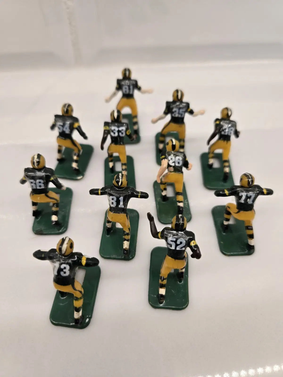 Vintage football figurines of Green Bay Packers players in NFL Tudor electronic toy