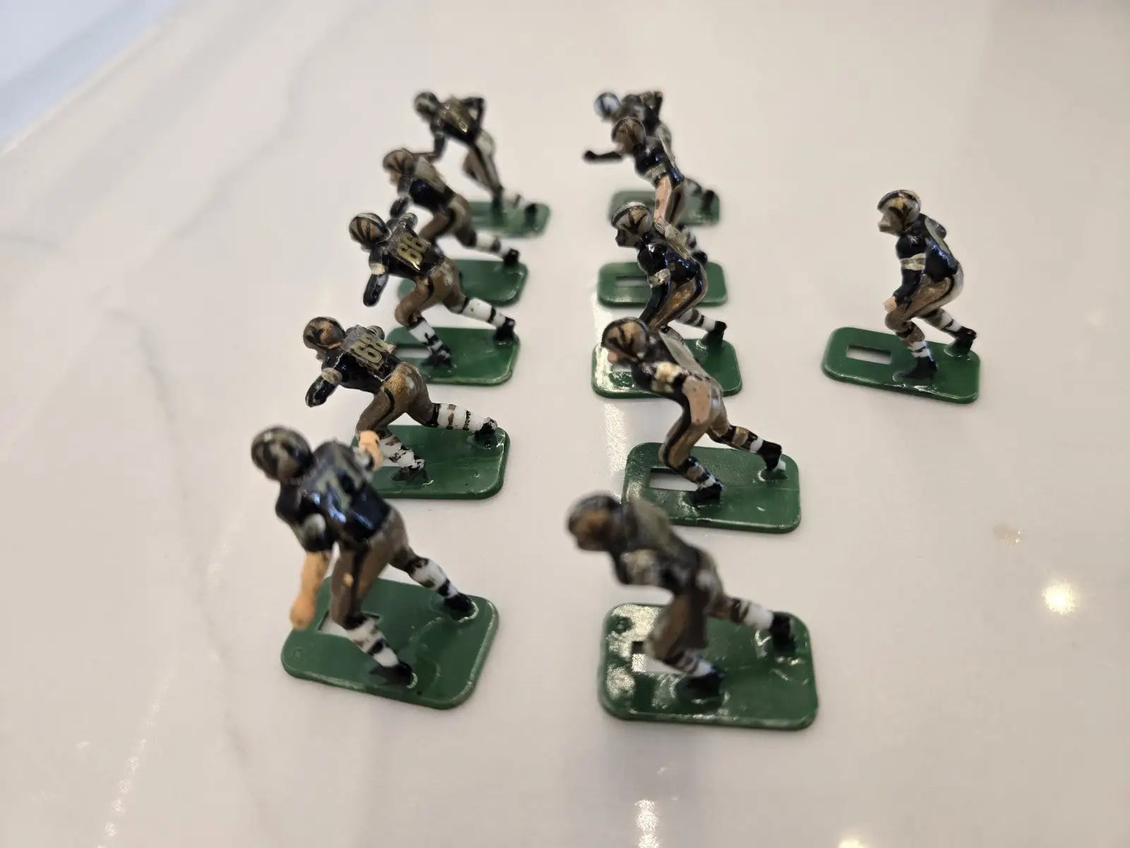 Vintage metal football figurines from the Orleans Saints Electronic player set
