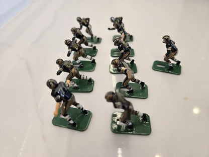 Vintage metal football figurines from the Orleans Saints Electronic player set