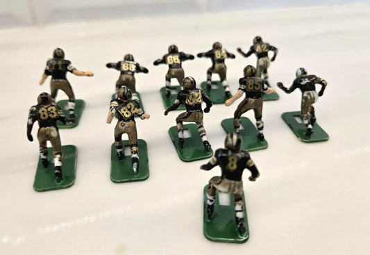 Miniature football team figures from Orleans Saints Electronic Player Set by Tudor
