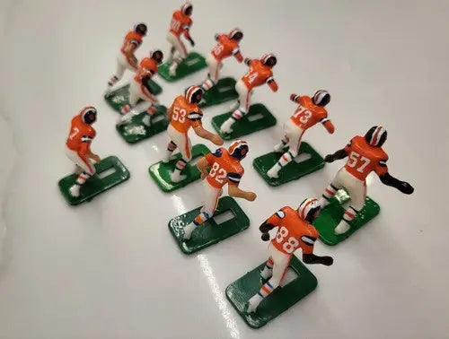 Miniature Denver Broncos electronic football player figurines from 1970’s Tudor set
