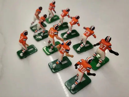 Miniature Denver Broncos electronic football player figurines from 1970’s Tudor set