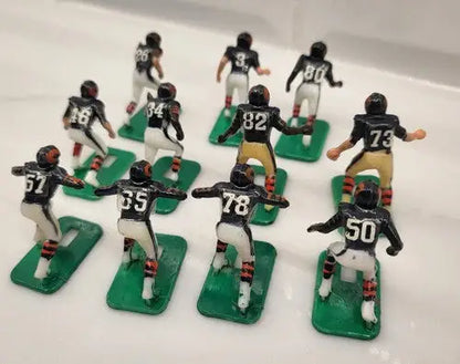 Miniature Chicago Bears electronic football players on green bases from NFL Vtg Haiti Tudor