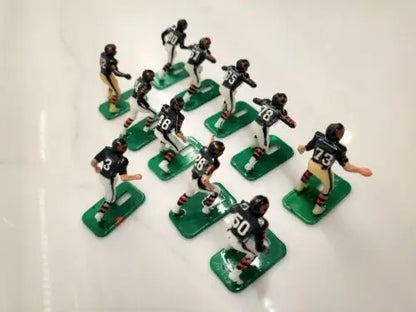 NFL Vtg Haiti Tudor 11 Chicago Bears Electronic Football Player Set displayed together