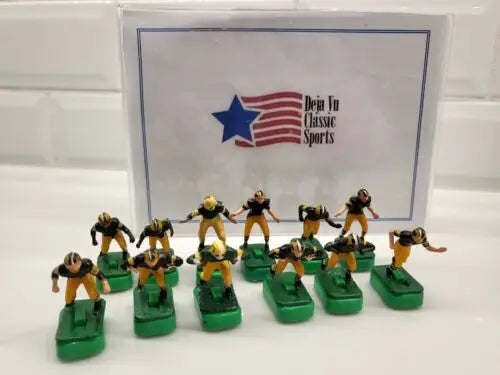 Miniature football figures of Green Bay Packers in NFL Vtg Tudor set with stands