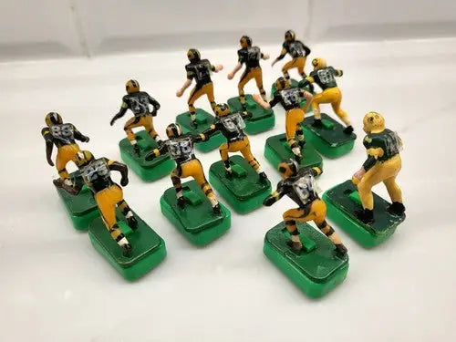 Vintage NFL Tudor Green Bay Packers electric football figures with stands for collectors