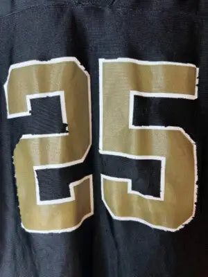 Black NFLPlayers sports jersey size large with gold number 25 and white trim featuring Reggie Bush