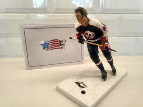 Bobby Hull hockey figurine in blue uniform for NHL Winnipeg Jets collectors