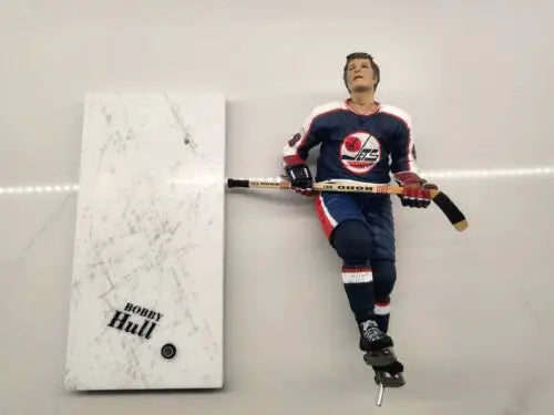 Bobby Hull figurine with display in NHL Winnipeg Jets blue uniform, repaired arm feature