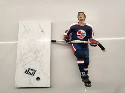 Bobby Hull figurine with display in NHL Winnipeg Jets blue uniform, repaired arm feature
