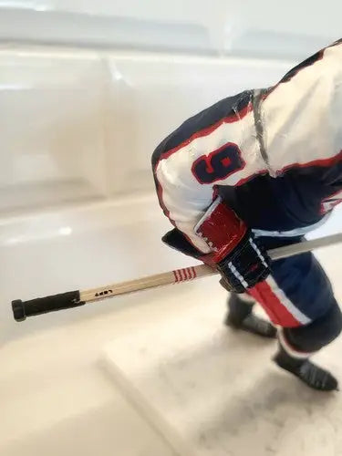 Hockey player figurine of Bobby Hull in blue uniform for NHL Winnipeg Jets collectors