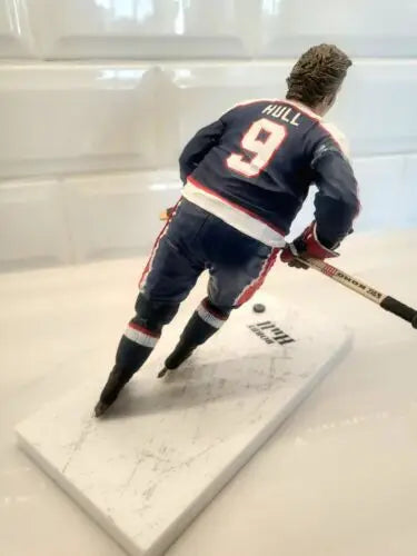 Hockey player figurine of Bobby Hull in blue uniform for NHL Winnipeg Jets collectible