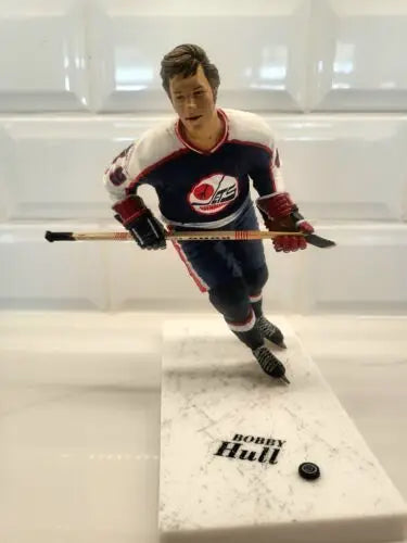 Bobby Hull hockey figurine in blue uniform for NHL Winnipeg Jets collectors