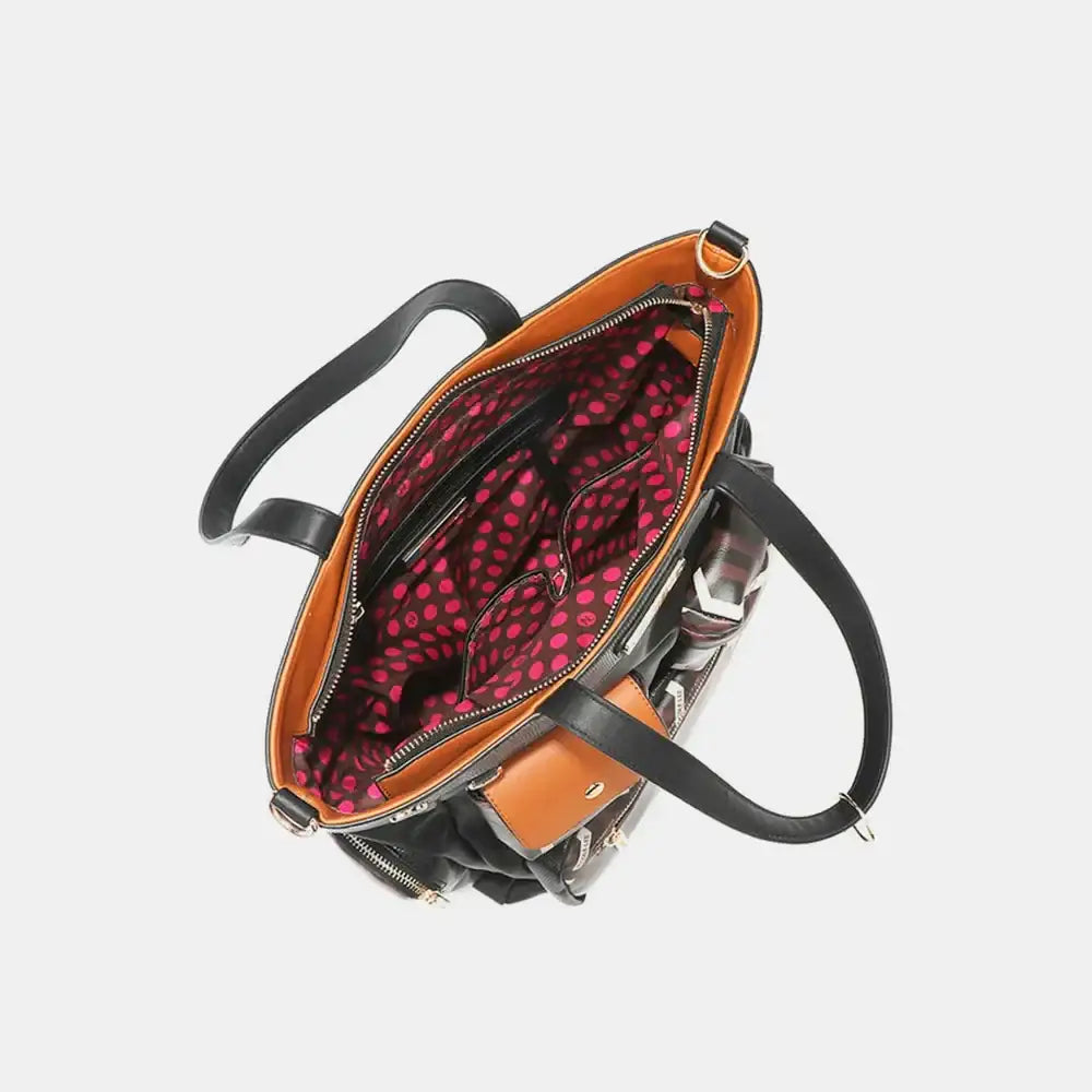 Nicole Lee vegan leather tote bag with gold hardware, red lining, and zip compartments