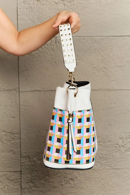 Multicolored plaid large shoulder bucket bag with white leather accents and studded strap