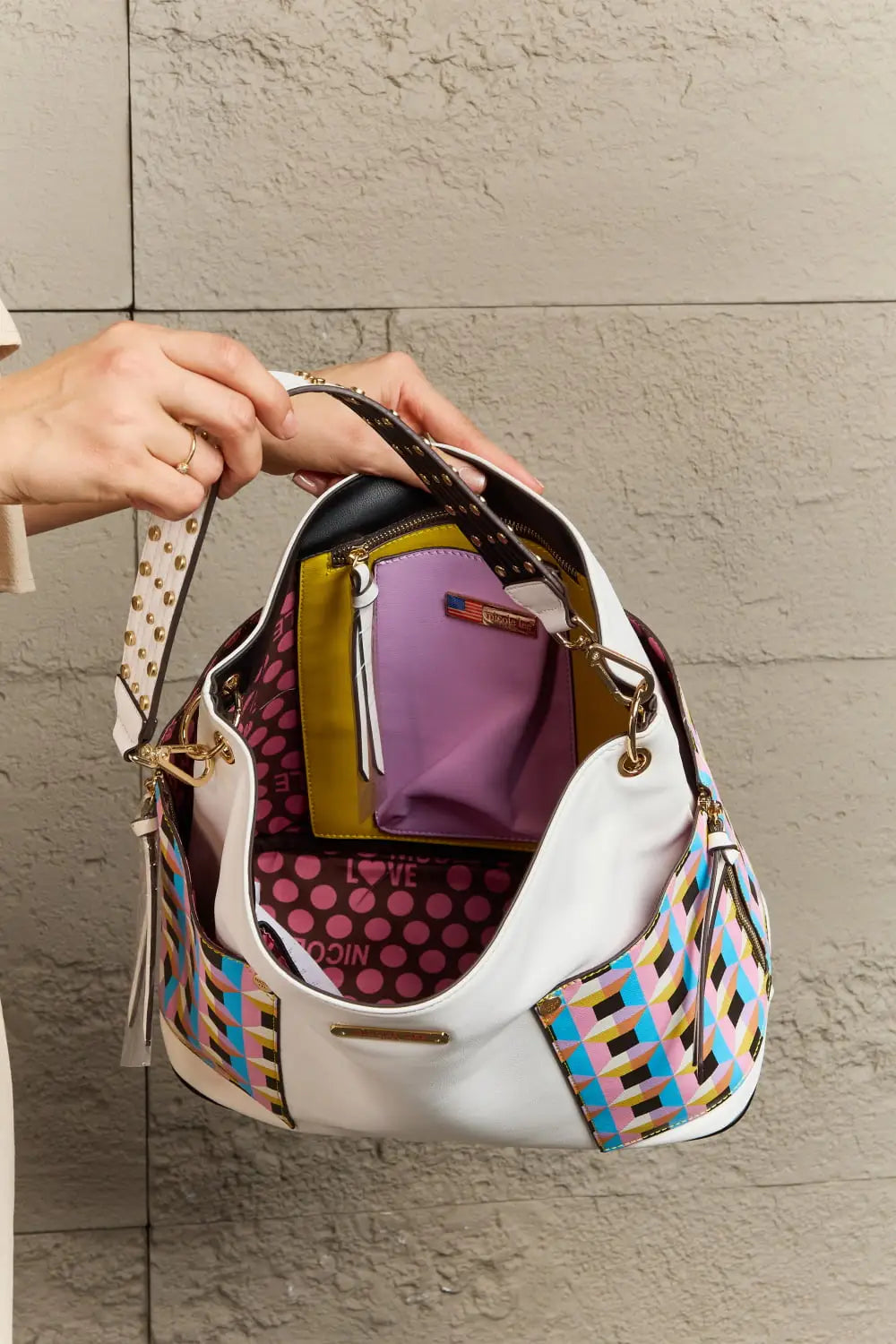 White and multicolored geometric patterned large shoulder bag with brown leather accents