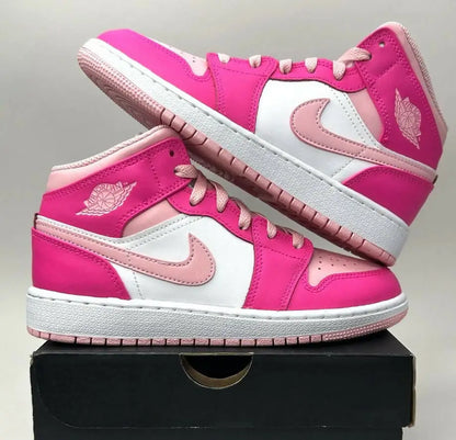 Pink and white Nike Air Jordan 1 Retro Mid Fierce Pink Barbie sneakers with light pink accents for fast shipping