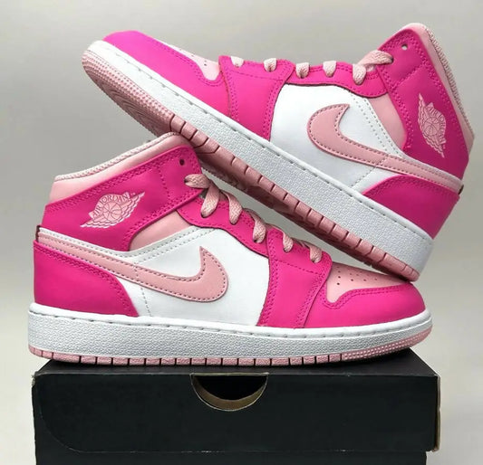 Pink and white Nike Air Jordan 1 Retro Mid Fierce Pink Barbie sneakers with light pink accents for fast shipping