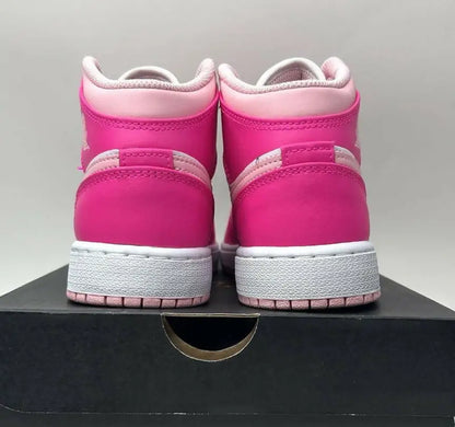 Vibrant pink Nike Air Jordan 1 Retro Mid Fierce Pink Barbie sneakers with white soles