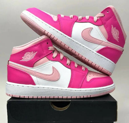 Vibrant pink and white Nike Air Jordan 1 Mid sneakers for fast shipping business days