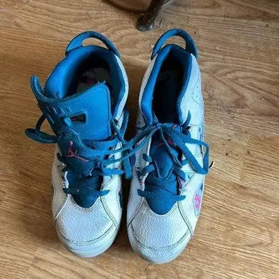 Nike Air Jordan high top sneakers for girls in white blue and pink with athletic style