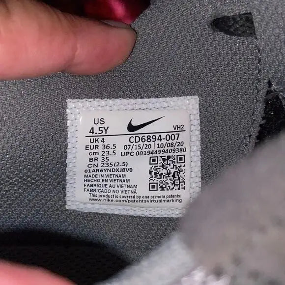 Nike Air Max Excee youth shoe size tag on Nike Air Max athletic sneakers