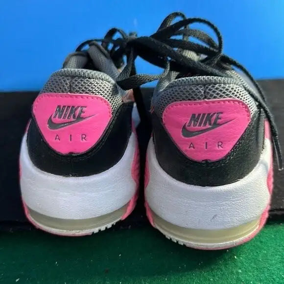 Pair of gray and pink Nike Air Max Excee youth running sneakers for kids