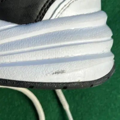 White sole and black upper of Nike Air Max Sneakers showing texture and subtle wear
