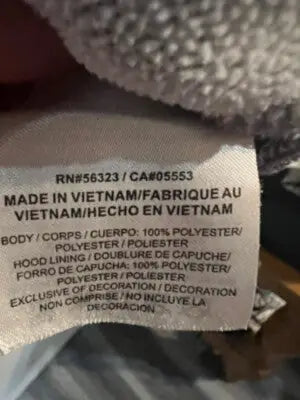 Clothing label with care instructions on Nike Heather Gray Pullover Hoodie