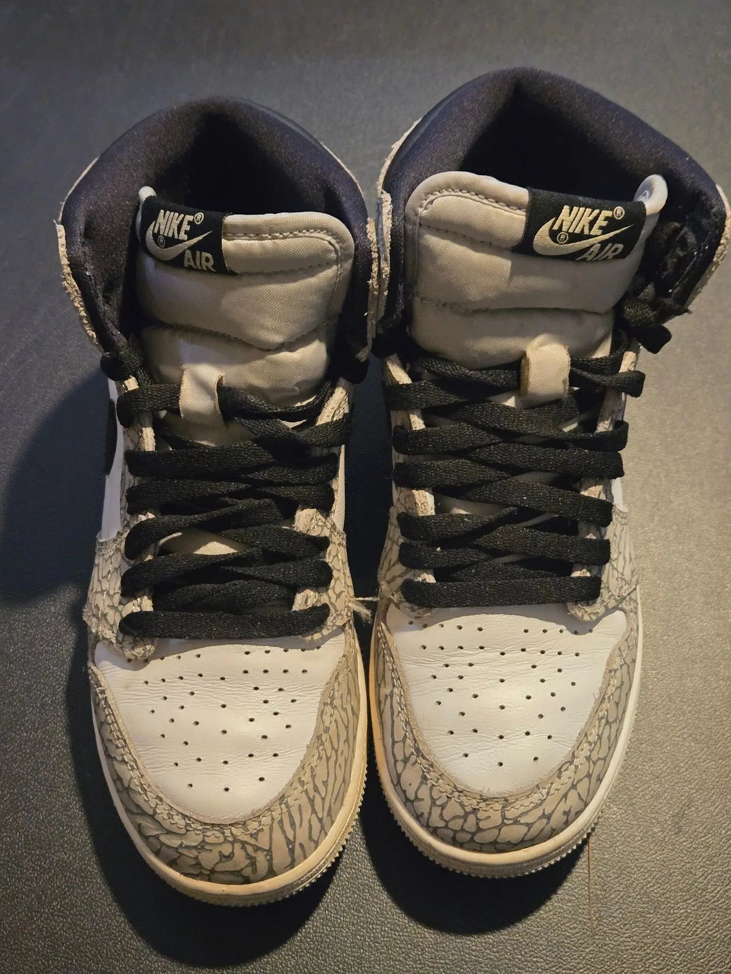 Nike Jordan Air leather high-top sneakers with elephant print overlays and black laces