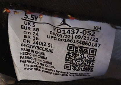 Sneaker size tag with manufacturing details and QR code for Nike Jordan Air Leather Shoes with elephant print