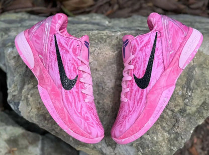 Vibrant pink Nike Kobe 6 Strawberry Milk sneakers with black swoosh and purple accents, fast shipping available