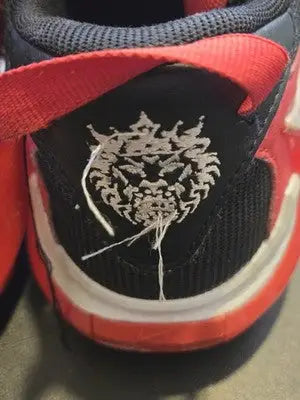 Nike LeBron Witness 4 Lion-Heel men’s basketball sneaker with mesh upper and lion emblem