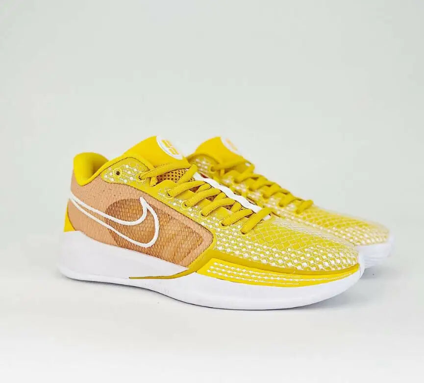 Nike Sabrina 1 Tb University Gold sneakers in yellow and brown with white soles and laces