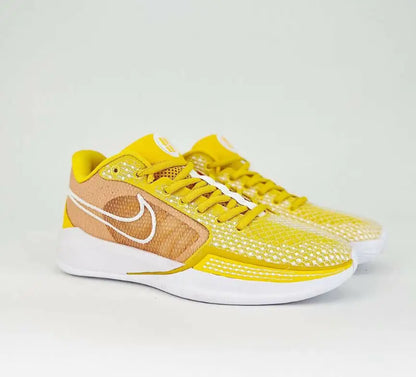 Nike Sabrina 1 Tb University Gold sneakers in yellow and brown with white soles and laces