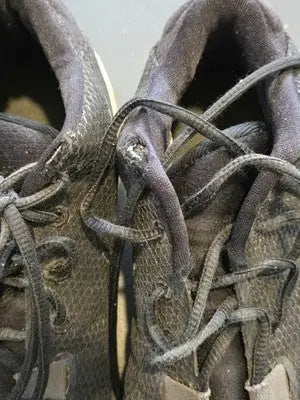 Well-worn Nike Zoom Freak 1 basketball shoes with dusty dark upper and worn laces