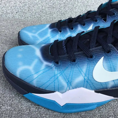 Light blue and dark blue Nike Zoom Kobe 7 Shark athletic shoes with white swooshes
