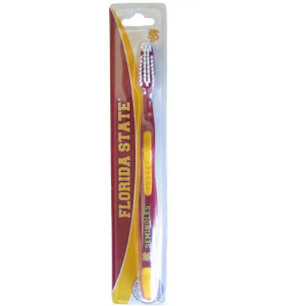 Yellow and maroon toothbrush in retail packaging for NCAA team fans and trading cards