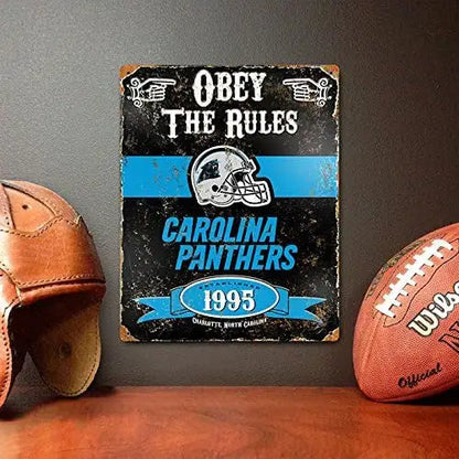 Vintage metal sign for Carolina Panthers NFL team with text Obey The Rules 1995