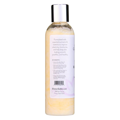 Yellow liquid in a clear bottle with silver cap for Organic Firming Body Lotion
