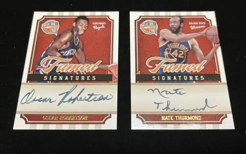 Two autographed basketball cards featuring Oscar Robertson and Nate Thurmond Auto from Panini Famed Signatures