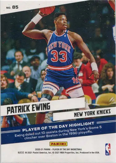 Basketball player in New York Knicks jersey 33 jumping with ball on parallel base card