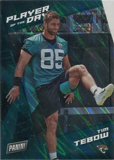 Football player in teal jersey 85 stretching leg on Panini silver parallel trading card